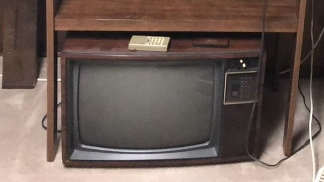 Original photo showing vintage television before cleanup
