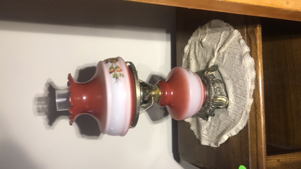 Original photo showing an oil lamp before cleanup