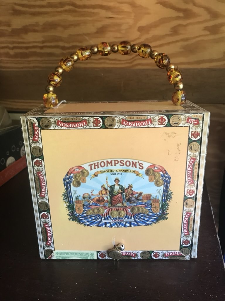 Original photo showing cigar box before cleanup