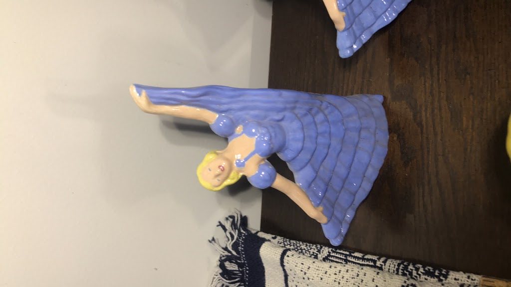 Original photo showing dancer figurine before cleanup