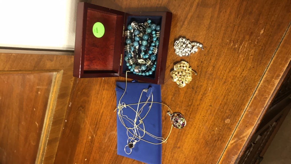 Original photo showing jewelry set before cleanup